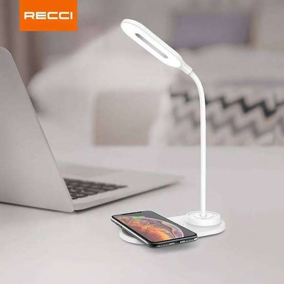 White desk LED lamp with wireless charging pad for smartphone on base stand