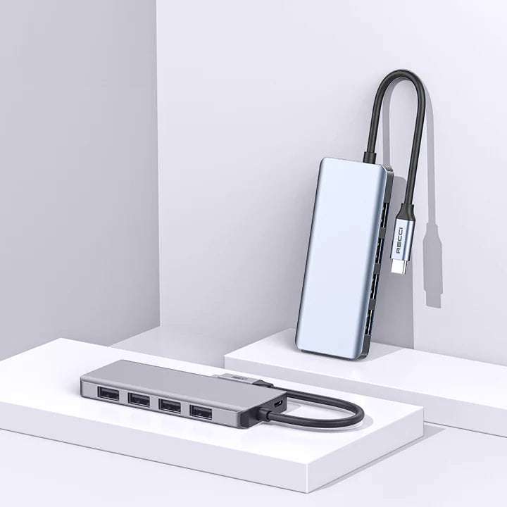 Gray USB-C 4-port hub with Micro USB plug, connected to Type-C cable