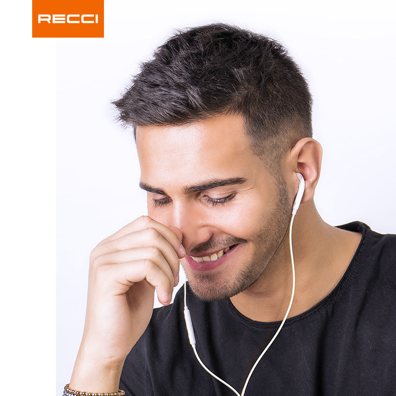 White Lightning wired earphones in use, man wearing one earbud