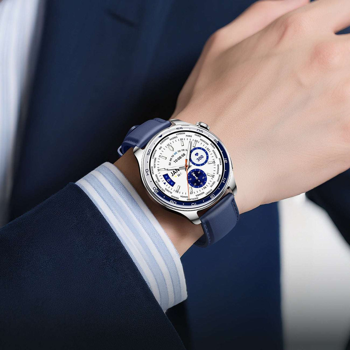 Smart watch on wrist with dark blue strap and blue dial on a white display face